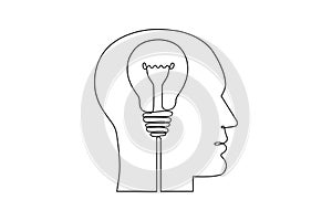 Continuous one line drawing of human head and electric light bulb. Concept of idea emergence. Vector photo